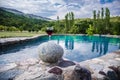 Drink in tall glass in poolside. Refreshment on summer day. Purple juice cocktail or vine. Royalty Free Stock Photo