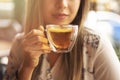 Drink Tea relax cosy photo with blurred background. Female hands holding mug of hot Tea in morning. Young woman relaxing tea cup Royalty Free Stock Photo