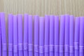 Drink tube of violet color in abstract background. Royalty Free Stock Photo