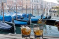 Drink for two in front of the Grand Canal of Venice - Romantic holiday for couples. Two glasses of liqueur with ice