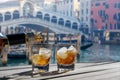 Drink for two in front of the Rialto bridge in Venice -