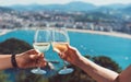 Drink two glasses white wine in friends hands outdoor sea nature holidays, romantic couple toast with alcohol, happy people cheer Royalty Free Stock Photo