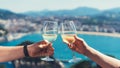 Drink two glasses white wine in friends hands outdoor sea nature holidays, romantic couple toast with alcohol, happy people cheer Royalty Free Stock Photo