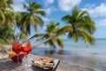 Drink for two on a tropical beach - two glasses of frozen cocktail and a plate of snacks Royalty Free Stock Photo