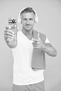 Drink water avoid thirst. Thirsty sportsman point at water bottle. Selective focus. Fit man advertise bottle to quench Royalty Free Stock Photo