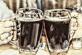 Drinking beer in the pub. glasses of beer in hands Royalty Free Stock Photo