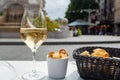 Drinking of brut champagne sparkling wine in street cafe in old central part of city Reims, Champagne, France