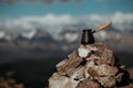 Drinking coffee with stunning mountain view. Beautiful Himalayas landscape with coffee cups and cezve. Drinking coffee