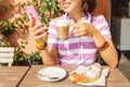 Drinking coffee and using phone in italian cafe, lifestyle, food and technology concept