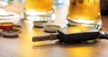 Drinking and driving. Car key on a wooden bar counter Royalty Free Stock Photo