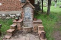 Drinking fountain with mosaic ikon of St. Petka, made of rock