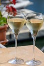 Drinking of French brut champagne sparkling wine in glasses, club party in yacht harbour of Port Grimaud near Saint-Tropez, French Royalty Free Stock Photo