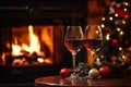 Drinking a glass of red wine in front of fireplace. Relaxing by the fire in cozy living room on winter day. Celebrating Christmas Royalty Free Stock Photo