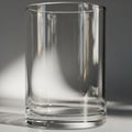 Drinking glass sits on a surface, reflecting light and casting subtle Royalty Free Stock Photo