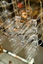Drinking glasses hanging from a rack in a bar or restaurant. Royalty Free Stock Photo
