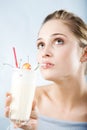 Drinking milk cocktail Royalty Free Stock Photo