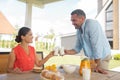 Couple drinking milk in the morning having breakfast outside