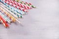 Drinking paper colorful straws for summer cocktails on grey background with copy space. Top view Royalty Free Stock Photo