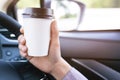 Drinking paper cup coffee of hot in hand while driving in a car Royalty Free Stock Photo