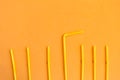 Drinking straws pattern on orange background Royalty Free Stock Photo
