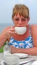 Drinking tea coffee alfresco at beach Royalty Free Stock Photo