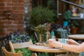 Drinking tea. woman holding cup of beverage while sitting at cafe. Royalty Free Stock Photo