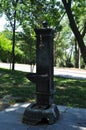 Cast iron water column in the city park Royalty Free Stock Photo