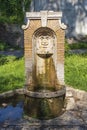 A Drinking water fountain Fontanella di Nerone in park Parco del Colle Oppio e delle terme di Traiano in Rome, Italy Royalty Free Stock Photo