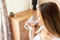 Drinking water pregnant woman. Young pregnancy mother drink water. Pregnant lady waiting of baby. Glass of water Royalty Free Stock Photo