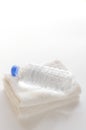 Drinking water and towels on white background Royalty Free Stock Photo