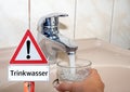 Drinking water warning triangle in german
