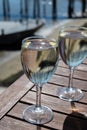 Drinking of white wine at farm cafe in oyster-farming village, with view of Arcachon bay, Cap Ferret peninsula, Bordeaux, France