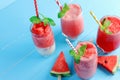 Drinks for the healthy of summer. Cold watermelon smoothie drinks top view, flat lay on blue wooden background Royalty Free Stock Photo