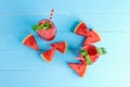 Drinks for the healthy of summer. Cold watermelon smoothie drinks top view, flat lay on blue wooden background Royalty Free Stock Photo