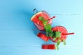 Drinks for the healthy of summer. Cold watermelon smoothie drinks top view, flat lay on blue wooden background Royalty Free Stock Photo