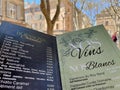 Drinks menu, old town of Aix en Provence in the background. Aix en Provence, France, 6.04.2023.