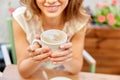 happy young woman drinking coffee at street cafe Royalty Free Stock Photo