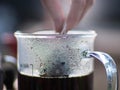 Drip bag brewing coffee ,pour over water on cup. Royalty Free Stock Photo