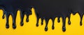Drip of black paint on yellow background with bold texture Royalty Free Stock Photo