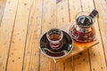 Drip coffee cup and coffee pot on wood table. Royalty Free Stock Photo