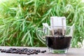 Drip coffee cup on a wooden table Royalty Free Stock Photo