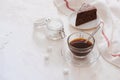 Drip coffee dripper and drip ground coffee with glass drip pot, cup and chocolate cake Royalty Free Stock Photo