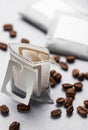 Drip coffee paper bags with coffee beans