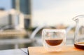 Drip freshly brewed coffee in a cup and glass pot on wooden tray. Hot brew coffee drink is good for health, Natural light. Royalty Free Stock Photo