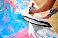 Drip painting expression art on canvas with blue, pink and beige colors, artist art performance Royalty Free Stock Photo