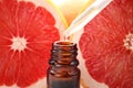 Dripping citrus essential oil into bottle, closeup