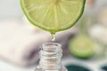 Dripping citrus essential oil into bottle, closeup