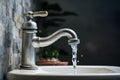 Dripping faucet signifies water wastage, urging conservation efforts