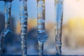 Dripping icicles against the sky. transparent icicle close up ag Royalty Free Stock Photo