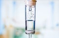 Dripping medical perfusion close up equipment in clinic background. Saline Solution IV Drip Fluid for Infusion in Hospital. Intrav Royalty Free Stock Photo